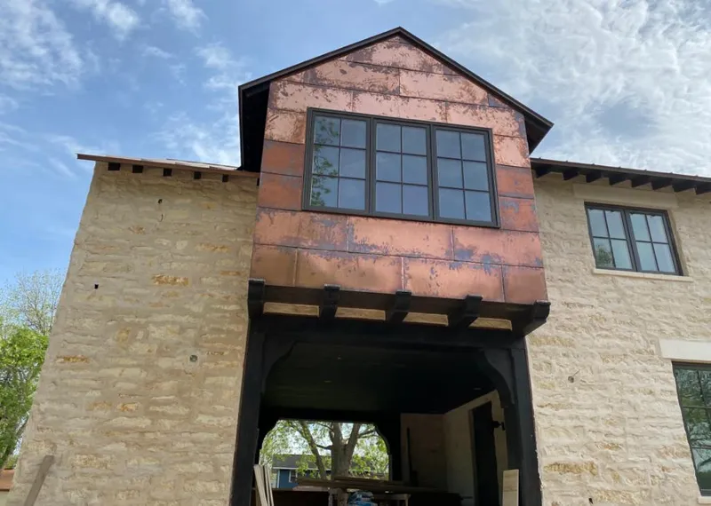 Copper metal panel facade on a stone building for Skylight Installation in Fort Pierce North