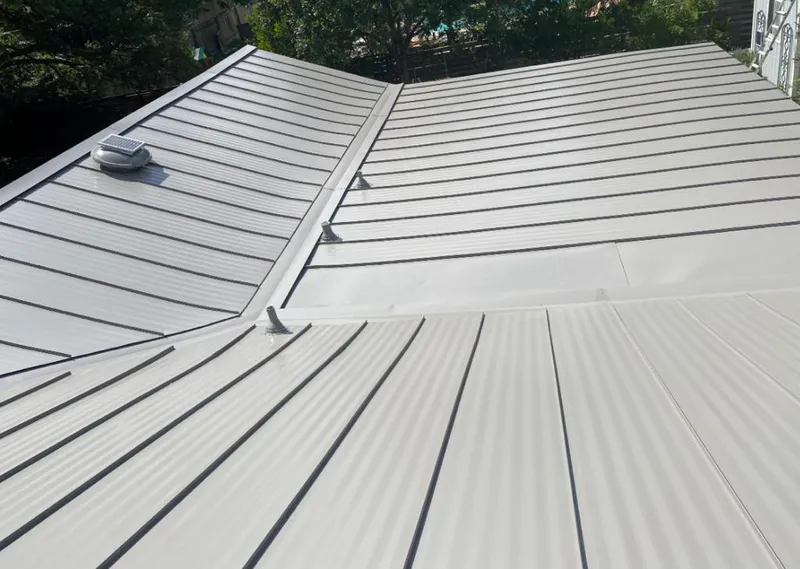 Solar attic fan installed on a metal roof for Roof Ventilation in Fort Pierce North